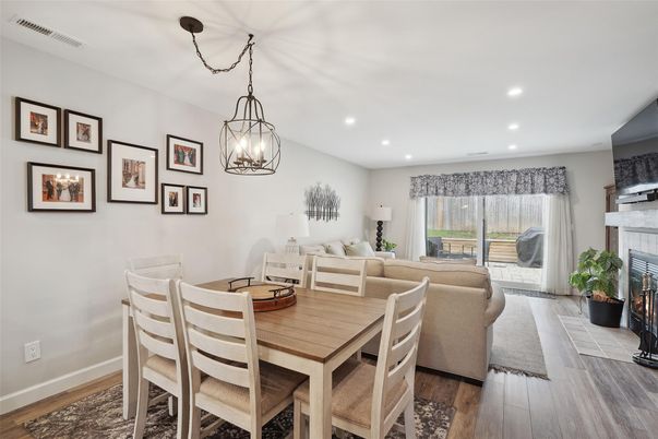 Dining room, Fireplace, Interior, Living room, Pendant Lights, Recessed Lighting, Wood Texture Flooring