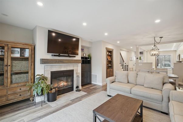 Dining room, Fireplace, Interior, Living room, Pendant Lights, Recessed Lighting, Wood Texture Flooring
