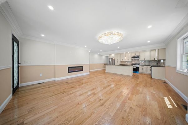 Chandelier, Empty room, Interior, Kitchen, Recessed Lighting, Stainless Steel Appliances, Wood Texture Flooring