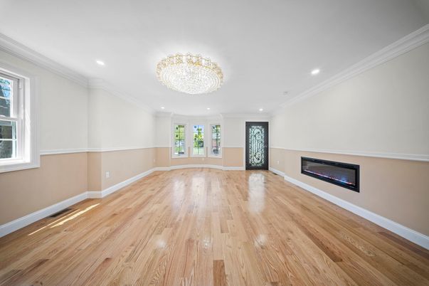 Chandelier, Empty room, Fireplace, Interior, Recessed Lighting, Wood Texture Flooring
