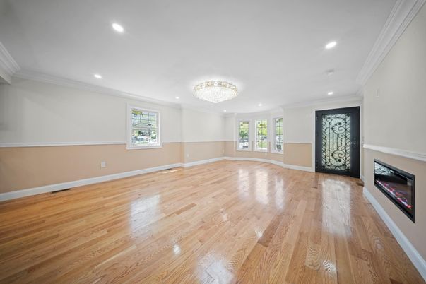 Chandelier, Empty room, Fireplace, Interior, Recessed Lighting, Wood Texture Flooring