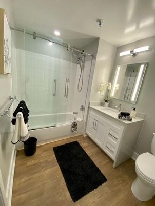 Bathroom, Dual Sink Vanities, Glass Shower, Interior, Recessed Lighting, Wood Texture Flooring
