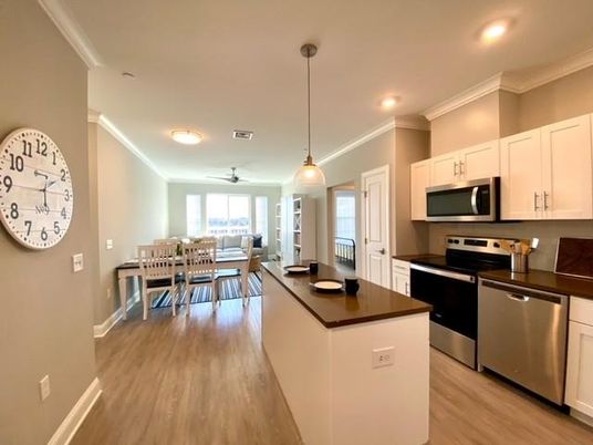 Dining room, Interior, Kitchen, Pendant Lights, Recessed Lighting, Stainless Steel Appliances, Wood Texture Flooring