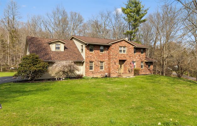 Attached, Backyard, Exterior, Facade, Brick Facade, Brick Traditional
