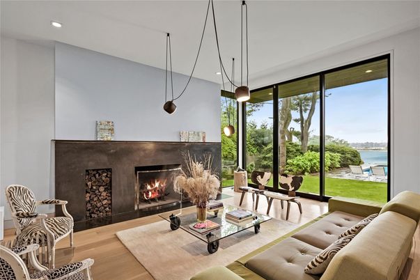 Fireplace, Interior, Living room, Pendant Lights, Recessed Lighting, Water, Wood Texture Flooring