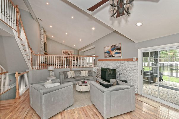 Fireplace, Interior, Living room, Recessed Lighting, Stone Walls, Wood Texture Flooring