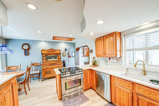 Dining room, Interior, Kitchen, Recessed Lighting, Stainless Steel Appliances, Wood Texture Flooring