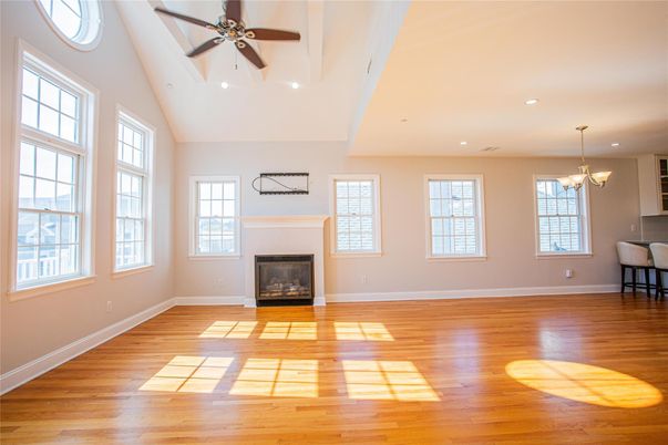 Chandelier, Empty room, Fireplace, Interior, Recessed Lighting, Wood Texture Flooring