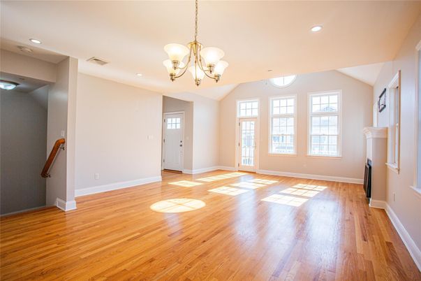 Chandelier, Empty room, Fireplace, Interior, Recessed Lighting, Wood Texture Flooring