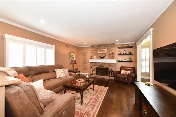 Fireplace, Interior, Living room, Recessed Lighting, Stone Walls, Wood Texture Flooring