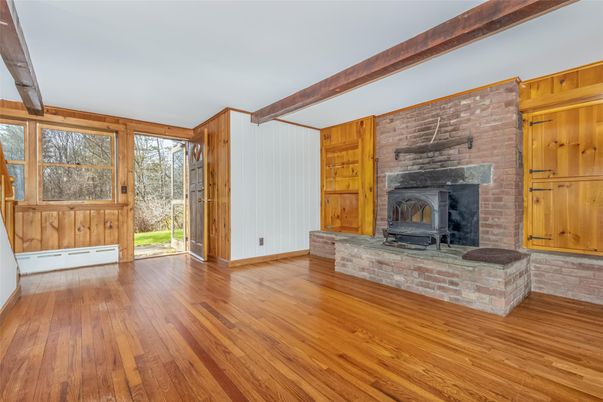 Empty room, Fireplace, Interior, Stone Walls, Wooden Beams, Wood Texture Flooring, Wooden Walls