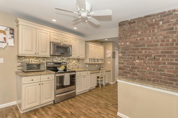 Interior, Kitchen, Recessed Lighting, Stainless Steel Appliances, Stone Walls, Wood Texture Flooring