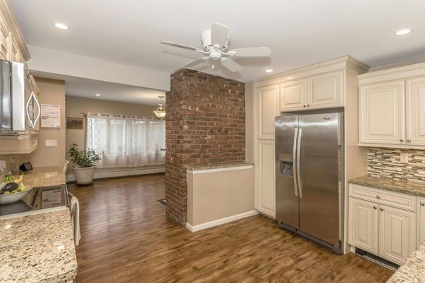 Interior, Kitchen, Recessed Lighting, Stainless Steel Appliances, Stone Walls, Wood Texture Flooring
