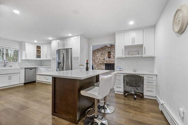 Fireplace, Interior, Kitchen, Recessed Lighting, Stainless Steel Appliances, Stone Walls, Wood Texture Flooring