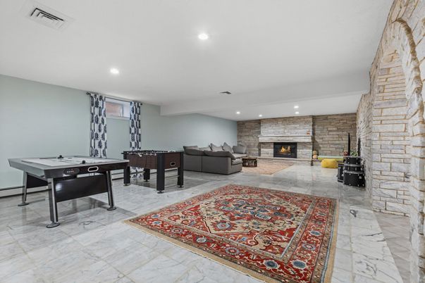 Fireplace, Game Room, Interior, Living room, Marble, Recessed Lighting, Stone Walls