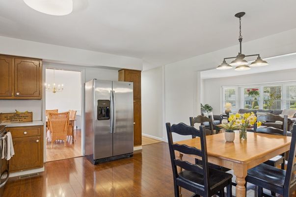 Chandelier, Dining room, Interior, Kitchen, Living room, Pendant Lights, Stainless Steel Appliances, Wood Texture Flooring