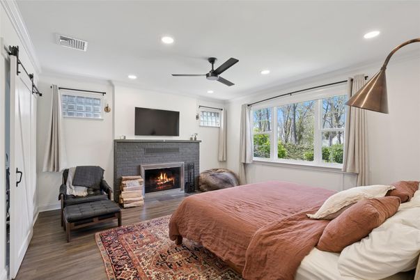 Bedroom, Fireplace, Interior, Recessed Lighting, Wood Texture Flooring