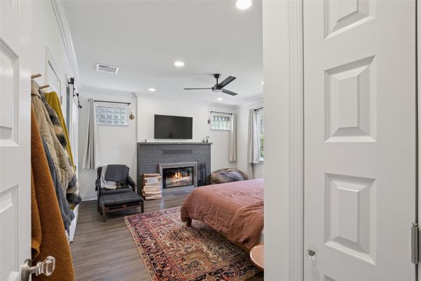 Bedroom, Fireplace, Interior, Recessed Lighting, Wood Texture Flooring