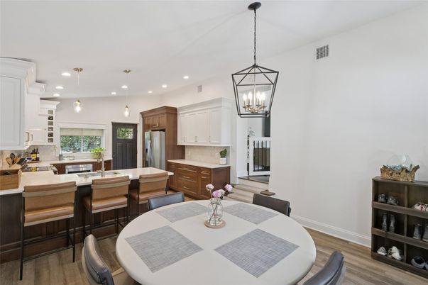 Dining room, Interior, Kitchen, Pendant Lights, Recessed Lighting, Stainless Steel Appliances, Wood Texture Flooring
