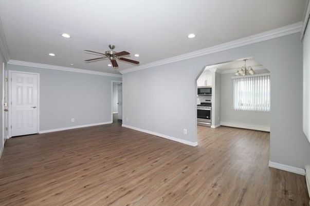 Chandelier, Empty room, Interior, Kitchen, Recessed Lighting, Stainless Steel Appliances, Wood Texture Flooring