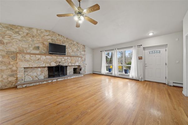 Empty room, Fireplace, Interior, Recessed Lighting, Stone Walls, Wood Texture Flooring