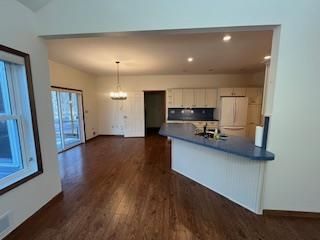 Chandelier, Interior, Kitchen, Pendant Lights, Recessed Lighting, Stainless Steel Appliances, Wood Texture Flooring