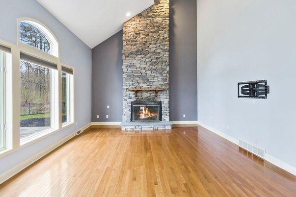 Empty room, Fireplace, Interior, Recessed Lighting, Stone Walls, Wood Texture Flooring