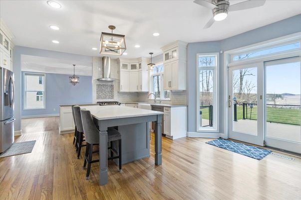 Chandelier, Dining room, Interior, Kitchen, Pendant Lights, Recessed Lighting, Stainless Steel Appliances, Wood Texture Flooring