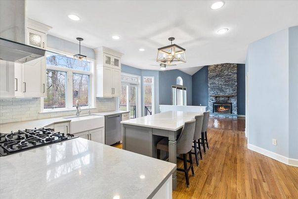 Fireplace, Interior, Kitchen, Pendant Lights, Recessed Lighting, Stainless Steel Appliances, Wood Texture Flooring