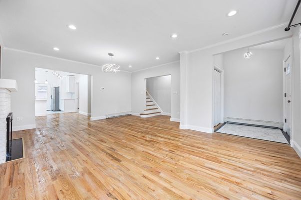 Chandelier, Empty room, Fireplace, Interior, Recessed Lighting, Wood Texture Flooring