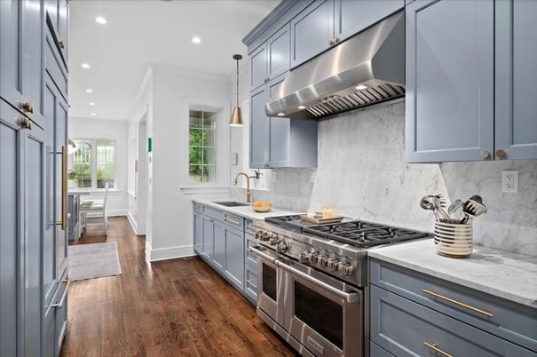 Interior, Kitchen, Marble Walls, Pendant Lights, Recessed Lighting, Stainless Steel Appliances, Wood Texture Flooring