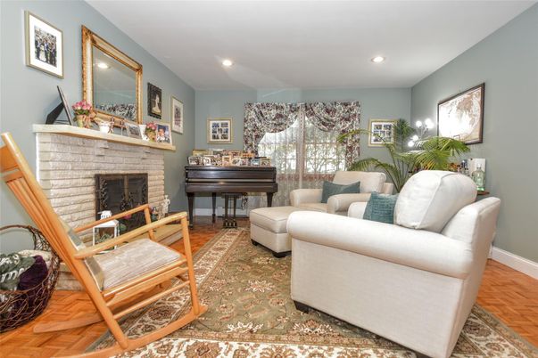 Fireplace, Interior, Living room, Piano, Recessed Lighting, Wood Texture Flooring