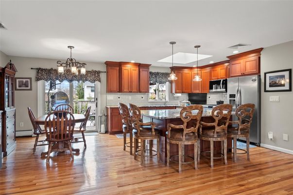 Chandelier, Dining room, Interior, Kitchen, Pendant Lights, Recessed Lighting, Stainless Steel Appliances, Wood Texture Flooring