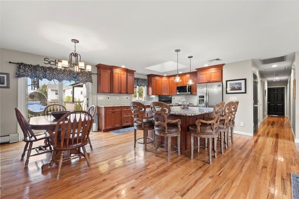 Chandelier, Dining room, Interior, Kitchen, Pendant Lights, Recessed Lighting, Stainless Steel Appliances, Wood Texture Flooring
