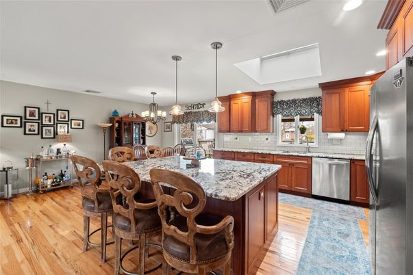 Chandelier, Dining room, Interior, Kitchen, Pendant Lights, Recessed Lighting, Stainless Steel Appliances, Wood Texture Flooring