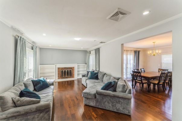 Chandelier, Dining room, Fireplace, Interior, Living room, Recessed Lighting, Wood Texture Flooring