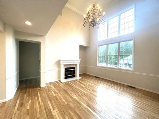 Chandelier, Empty room, Fireplace, Interior, Recessed Lighting, Wood Texture Flooring