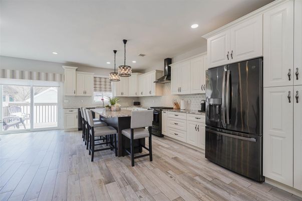 Chandelier, Dining room, Interior, Kitchen, Pendant Lights, Recessed Lighting, Stainless Steel Appliances, Wood Texture Flooring