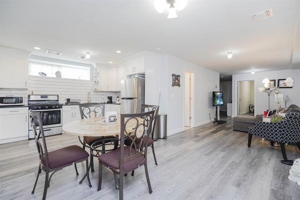 Dining room, Interior, Kitchen, Recessed Lighting, Stainless Steel Appliances, Wood Texture Flooring