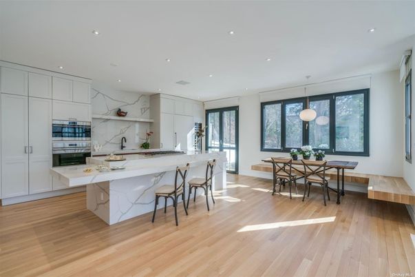 Dining room, Interior, Kitchen, Marble Walls, Pendant Lights, Recessed Lighting, Stainless Steel Appliances, Wood Texture Flooring