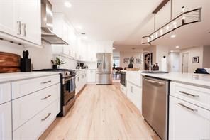 Interior, Kitchen, Pendant Lights, Recessed Lighting, Stainless Steel Appliances, Wood Texture Flooring