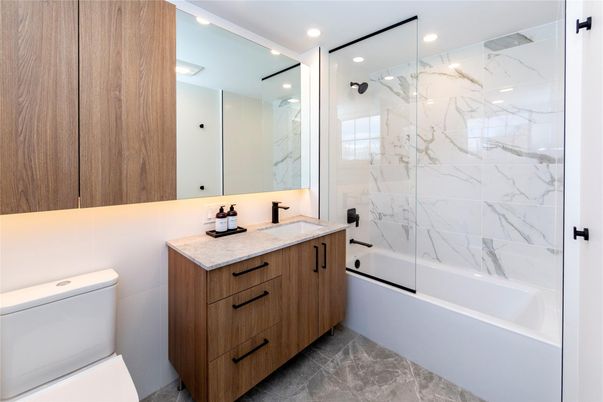 Bathroom, Dual Sink Vanities, Glass Shower, Interior, Marble Walls, Recessed Lighting