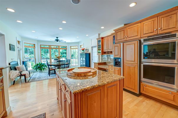 Dining room, Interior, Kitchen, Living room, Recessed Lighting, Stainless Steel Appliances, Wood Texture Flooring