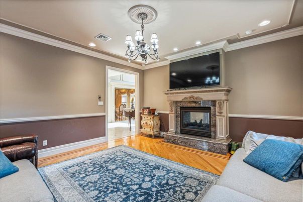 Chandelier, Fireplace, Interior, Living room, Recessed Lighting, Wood Texture Flooring