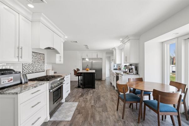 Dining room, Interior, Kitchen, Recessed Lighting, Stainless Steel Appliances, Wood Texture Flooring