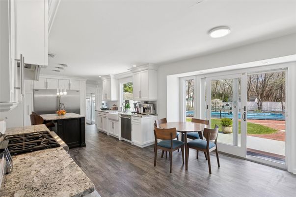 Dining room, Interior, Kitchen, Pendant Lights, Recessed Lighting, Stainless Steel Appliances, Wood Texture Flooring