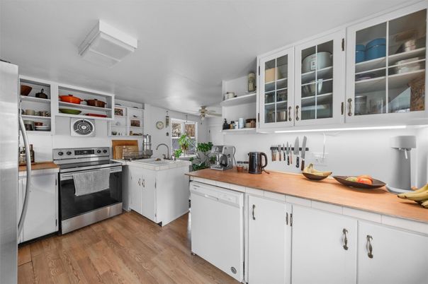 Interior, Kitchen, Stainless Steel Appliances, Tile Countertops, Wood Texture Flooring