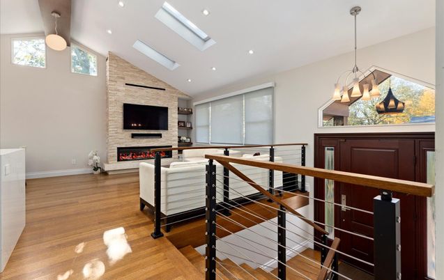 Fireplace, Interior, Living room, Pendant Lights, Recessed Lighting, Stone Walls, Wood Texture Flooring