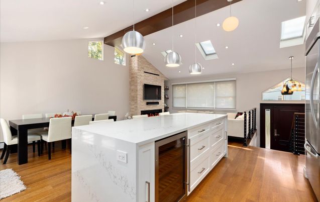 Dining room, Fireplace, Interior, Kitchen, Pendant Lights, Recessed Lighting, Stainless Steel Appliances, Stone Walls, Wood Texture Flooring
