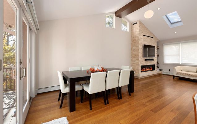 Dining room, Fireplace, Interior, Pendant Lights, Recessed Lighting, Stone Walls, Wood Texture Flooring
